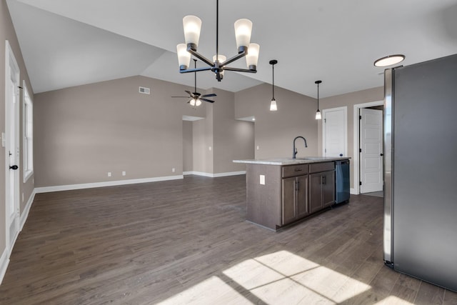 kitchen featuring open floor plan, dark wood-style flooring, freestanding refrigerator, vaulted ceiling, and ceiling fan with notable chandelier