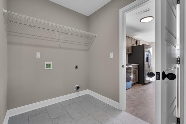 laundry room featuring laundry area, baseboards, visible vents, marble finish floor, and electric dryer hookup