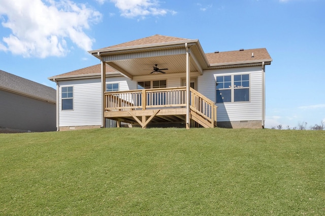 rear view of property with a ceiling fan, crawl space, a lawn, and a wooden deck