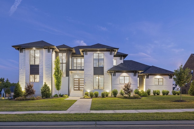 view of front of house with a yard