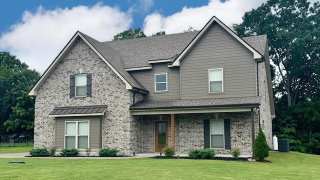 view of front of property with a porch, central air condition unit, and a front yard