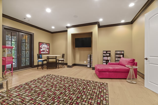 living area featuring ornamental molding, french doors, and wood-type flooring