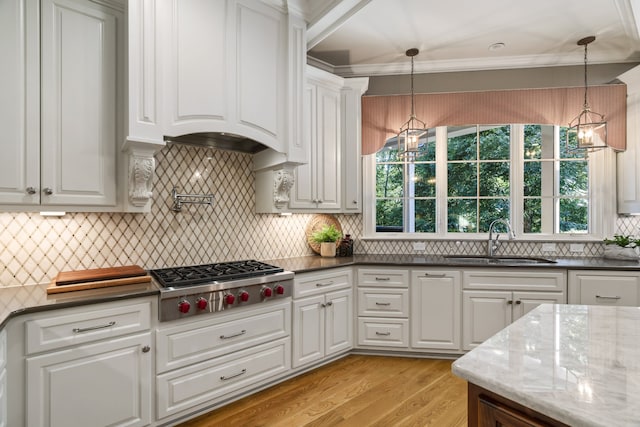 kitchen featuring hanging light fixtures, sink, and a healthy amount of sunlight