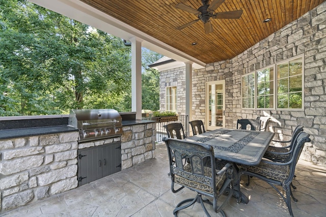 view of patio featuring area for grilling and ceiling fan