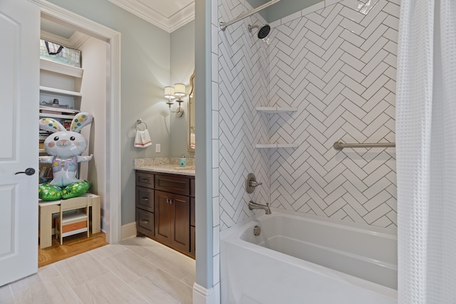 bathroom featuring tile floors, ornamental molding, shower / bath combo, and vanity