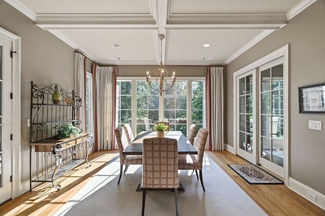 dining room featuring beamed ceiling, crown molding, coffered ceiling, and light hardwood / wood-style flooring