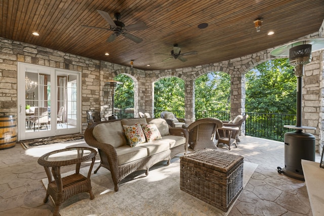 view of terrace featuring an outdoor hangout area, french doors, and ceiling fan