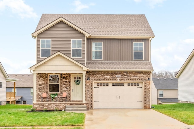 view of front facade with a front yard and a garage