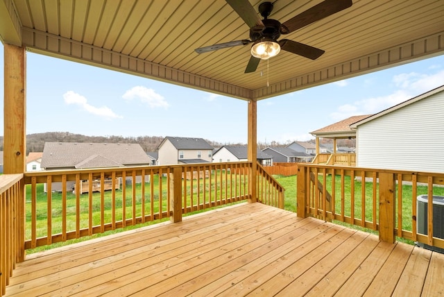 deck with a yard, ceiling fan, and central air condition unit