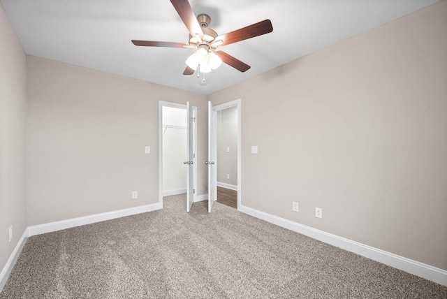 unfurnished bedroom featuring carpet, ceiling fan, and a closet