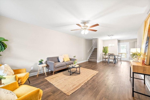 living room featuring dark hardwood / wood-style floors and ceiling fan