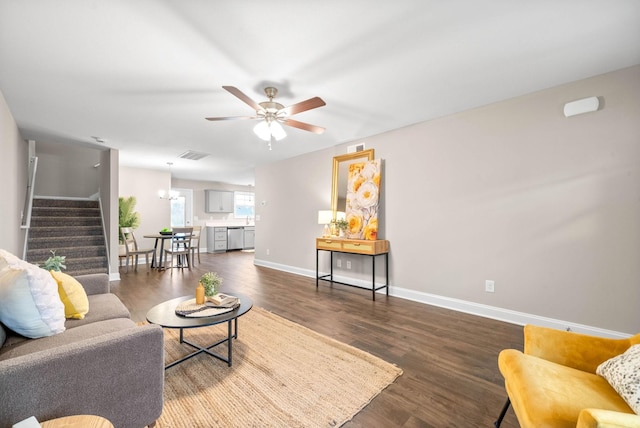 living room featuring ceiling fan and dark hardwood / wood-style flooring