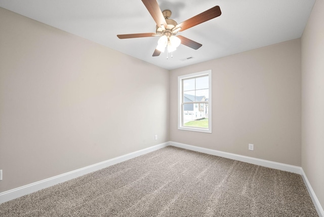 carpeted empty room with ceiling fan