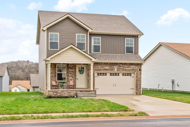 view of front of house with a garage and a front lawn