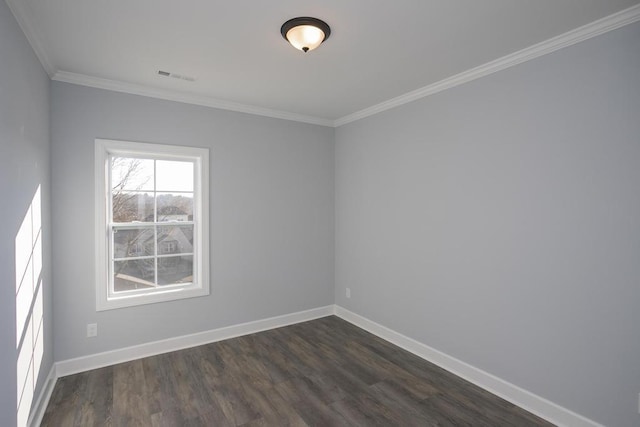 spare room with crown molding and dark hardwood / wood-style floors