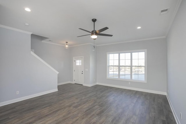 interior space with ceiling fan, dark hardwood / wood-style flooring, and ornamental molding