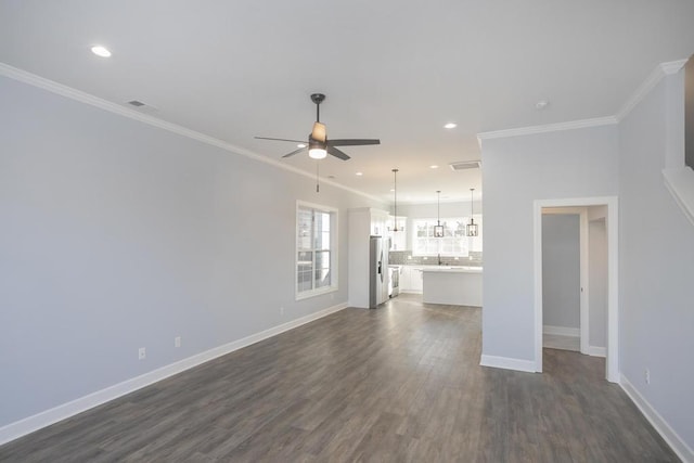 unfurnished living room with dark hardwood / wood-style floors, ceiling fan, and ornamental molding