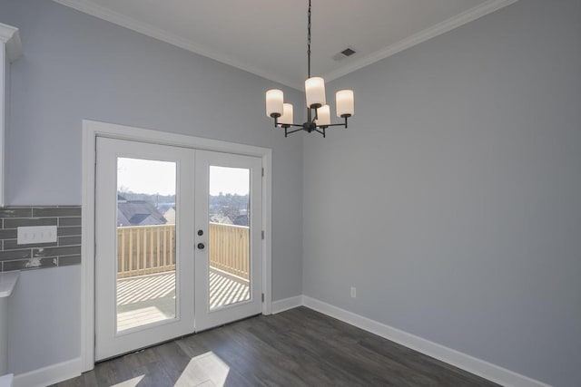 doorway to outside with crown molding, french doors, a chandelier, and dark hardwood / wood-style floors