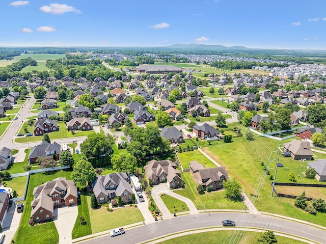 birds eye view of property with a mountain view