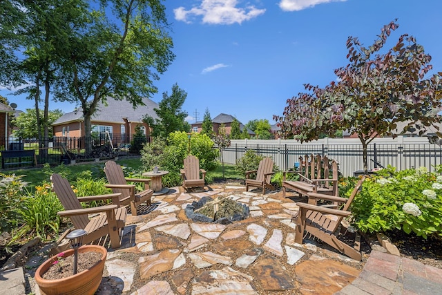 view of patio / terrace with a fire pit