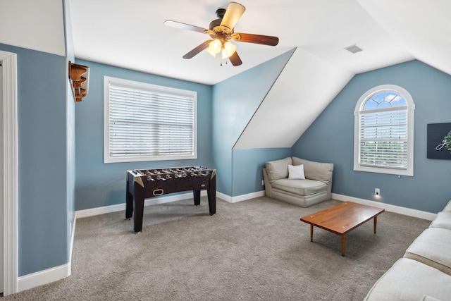 interior space featuring light carpet, ceiling fan, and lofted ceiling