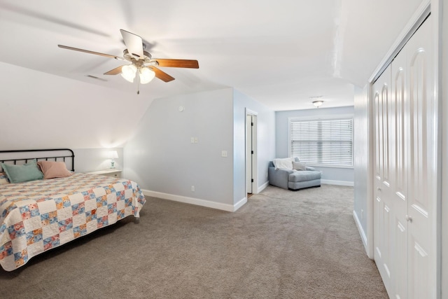 bedroom with ceiling fan, light carpet, and lofted ceiling