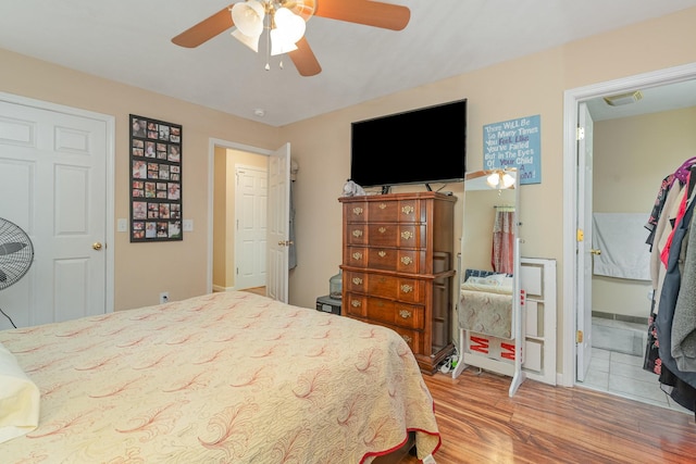 bedroom featuring hardwood / wood-style floors and ceiling fan