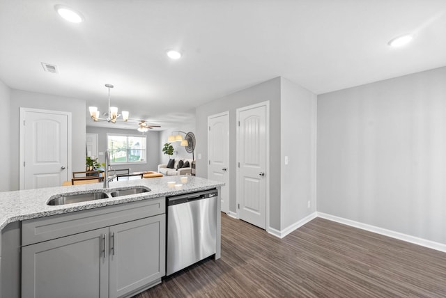 kitchen with dark wood-type flooring, a sink, visible vents, baseboards, and stainless steel dishwasher