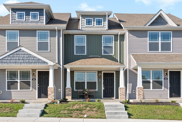 view of property with a shingled roof