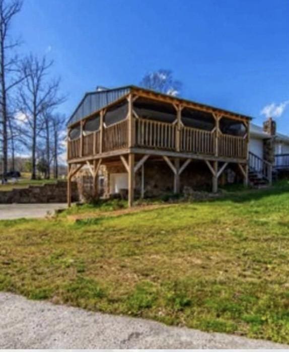 rear view of house with a yard