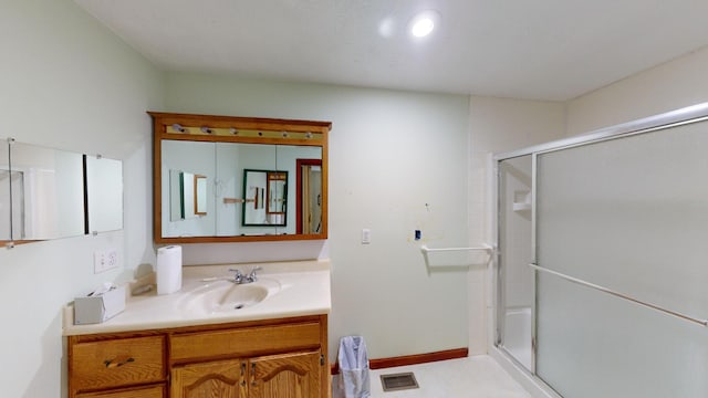 bathroom featuring vanity and walk in shower