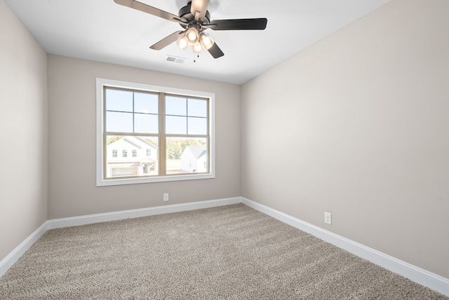 carpeted empty room featuring ceiling fan