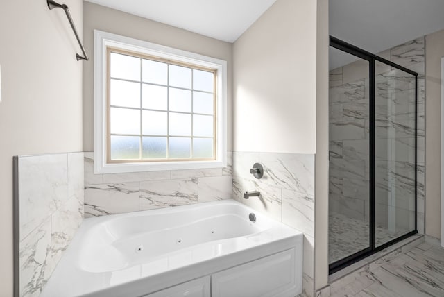 bathroom featuring a wealth of natural light, tile walls, and shower with separate bathtub