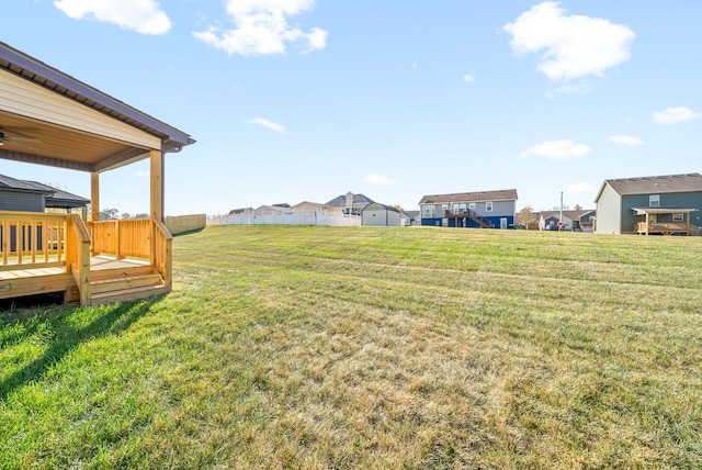 view of yard featuring a wooden deck