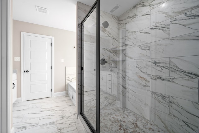 bathroom featuring a shower with door