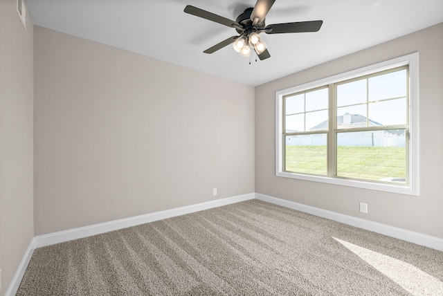 unfurnished room featuring ceiling fan, carpet flooring, and plenty of natural light