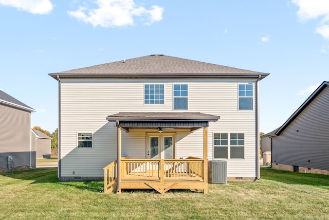 rear view of house featuring a wooden deck, a lawn, and central AC unit