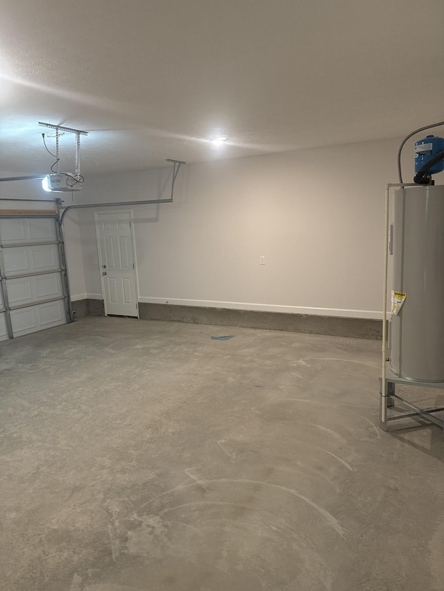 garage with water heater and a garage door opener