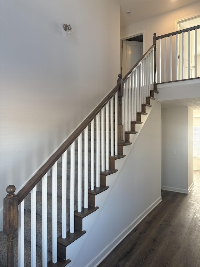 stairway featuring hardwood / wood-style floors