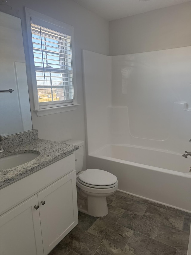 full bathroom with shower / tub combination, vanity, and toilet