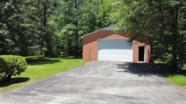 garage featuring a yard