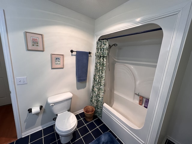 bathroom with tile floors, shower / bath combination with curtain, and toilet