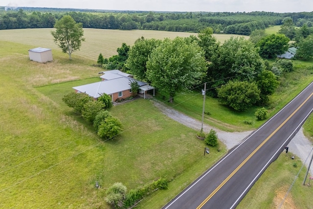 birds eye view of property with a rural view