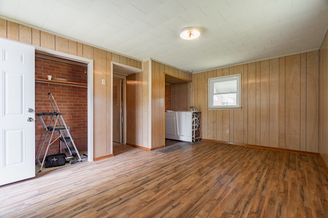 interior space featuring wood walls and hardwood / wood-style floors