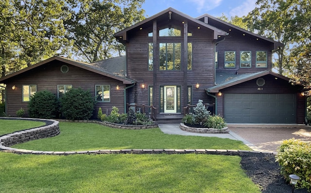 view of front facade featuring a garage and a front lawn