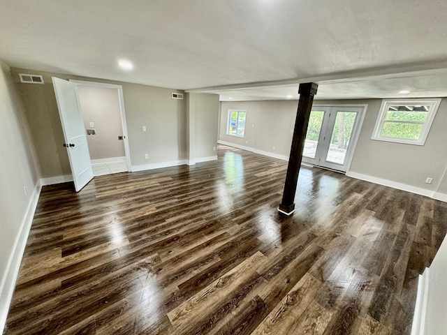 interior space with dark hardwood / wood-style floors and french doors