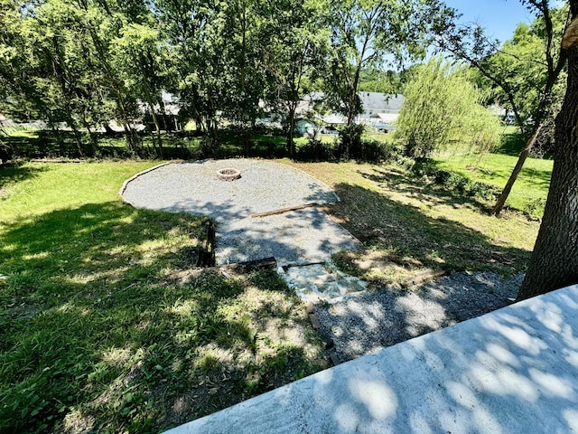 view of yard with a fire pit