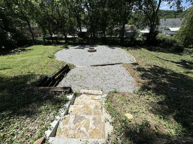 view of yard featuring a fire pit