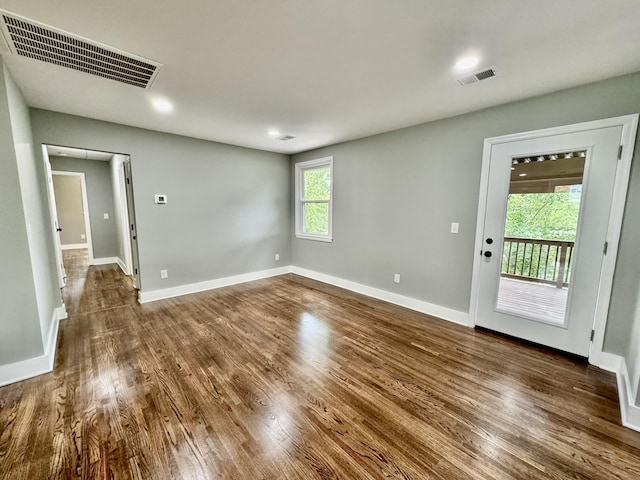 empty room with dark hardwood / wood-style floors