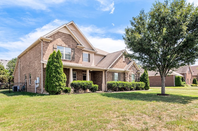 craftsman-style home featuring central AC and a front lawn